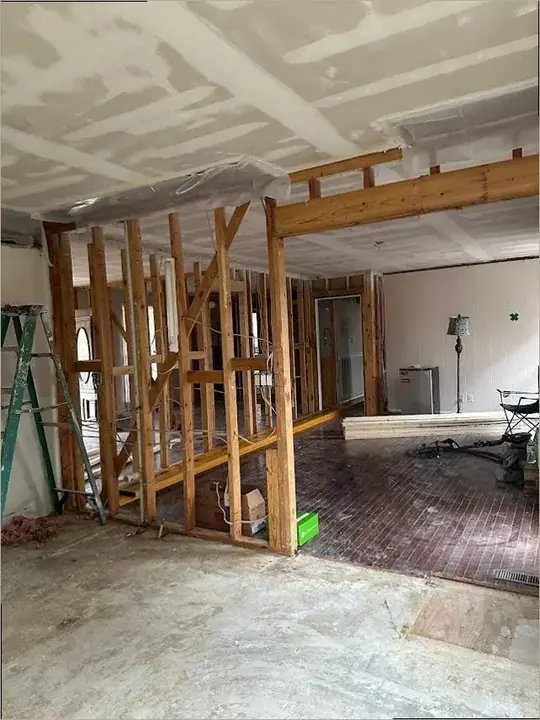 Framing opened to dry a wall cavity