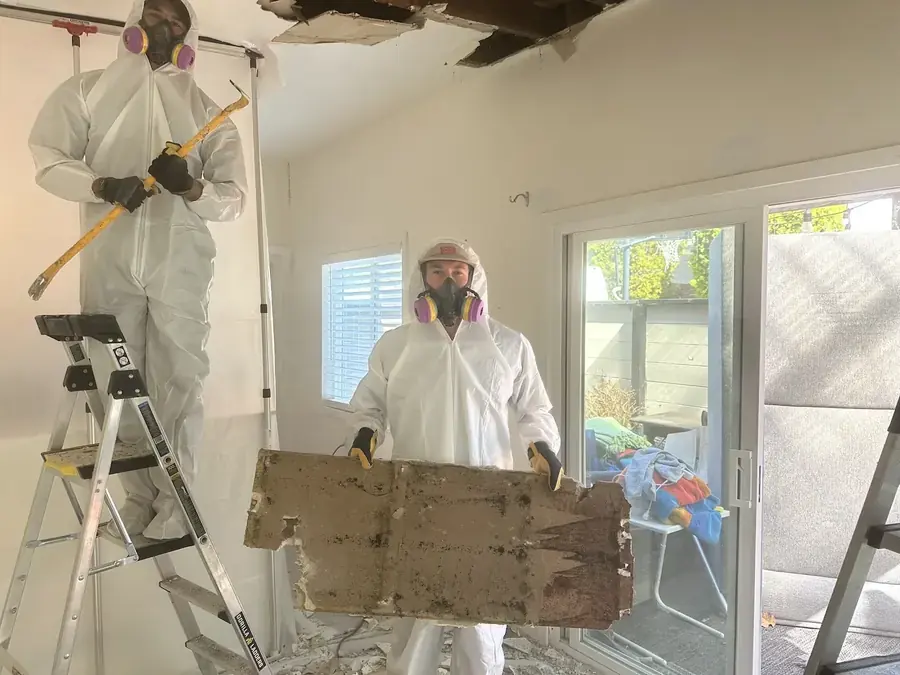 ICS Restoration technician removing wet drywall in a Garland, TX home